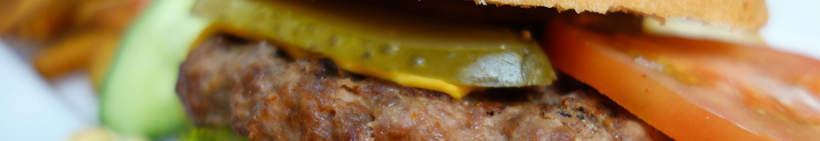 Eating Barbeque Burger Fast Food at Piggie Park restaurant in Thomaston, GA.